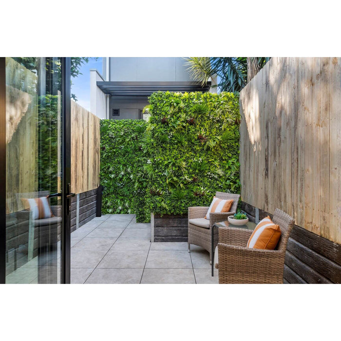 Premium Artificial Vertical Garden Panel Vista Green Installed along a back fence for privacy