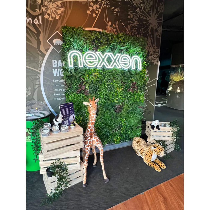 Artificial Living Wall with Corporate Signage on a Moving Stand Mounted to a Wall