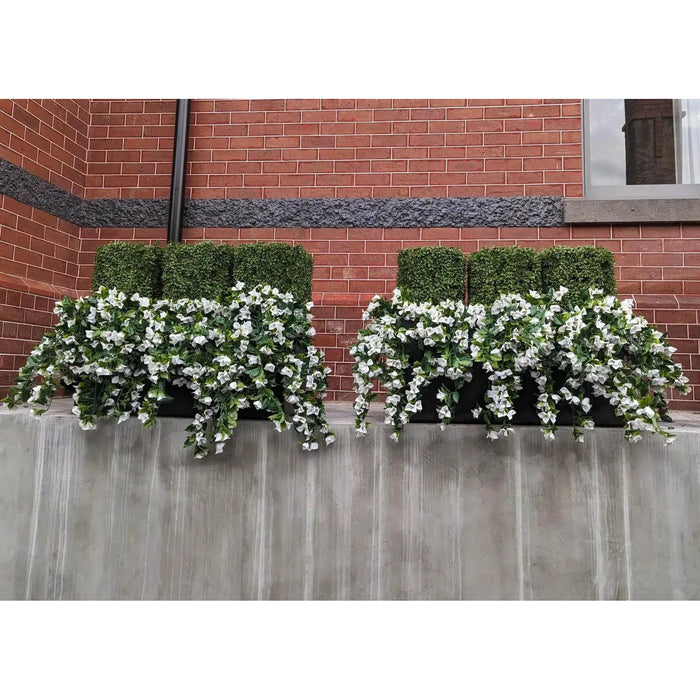 Two (5 Pieces) Hanging White Artificial Bougainvillea Plant UV Resistant 35" flower boxes on the side of a brick building.