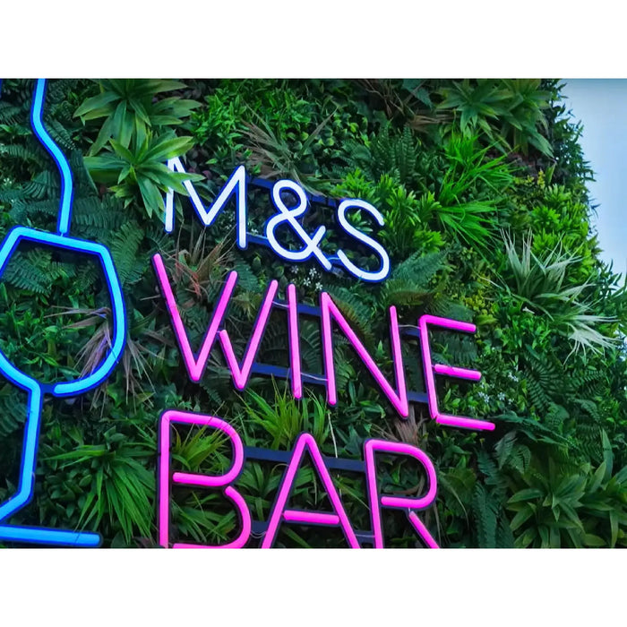 Plastic plant wall panels with business signage