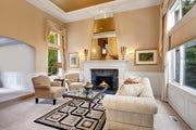 Luxurious living room with beige walls, a Modern Flames fireplace, and elegant furniture.