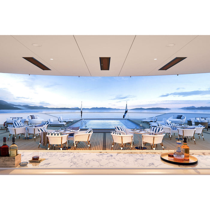 Yacht deck with dining area and pool, overlooking water and mountains. Bromic Marine Heaters area seen recessed into the ceiling above