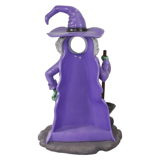 Back view of Purple witch figurine photo op with a broom on a white background