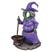 Side view of a Purple witch figurine photo op with a cauldron on a white background