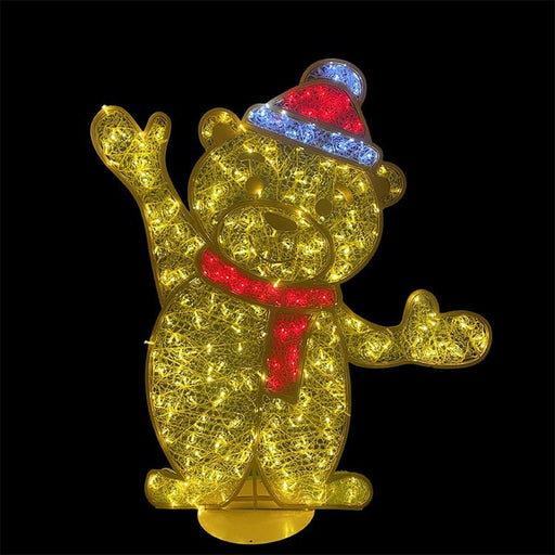 Decorative lighted bear figure with a red scarf and colorful hat on a black background