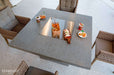 Outdoor Elementi Birmingham Fire Table with Cover table with chairs and food items on a bright day
