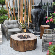 Outdoor patio with fire pit, chairs, and decorative elements