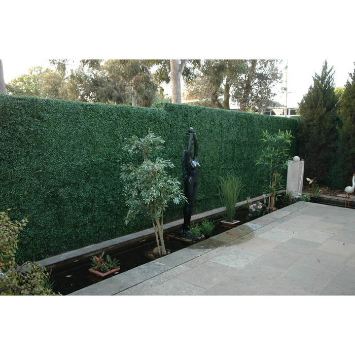 Artificial Boxwood Hedge Panels Installed Into a Miami Landscape backyard