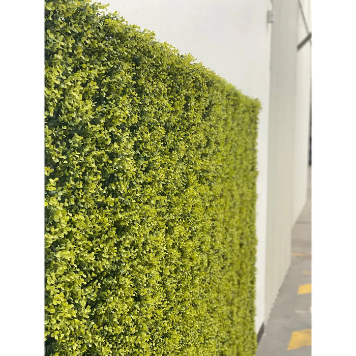 Yellow Boxwood Faux Hedge Panel on a Fence