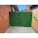 Privacy fence using faux artificial boxwood hedge panels