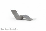 An Autograph Chaise Sunlounger designed for poolside use or in pool use, featuring a curved and ergonomic design. Shown in Ledge Lounger's Granite Gray color