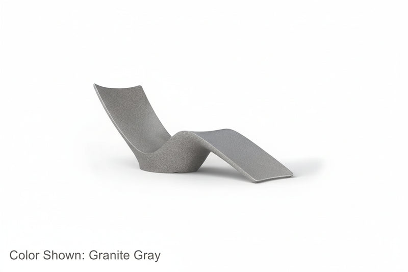 An Autograph Chaise Sunlounger designed for poolside use or in pool use, featuring a curved and ergonomic design. Shown in Ledge Lounger's Granite Gray color