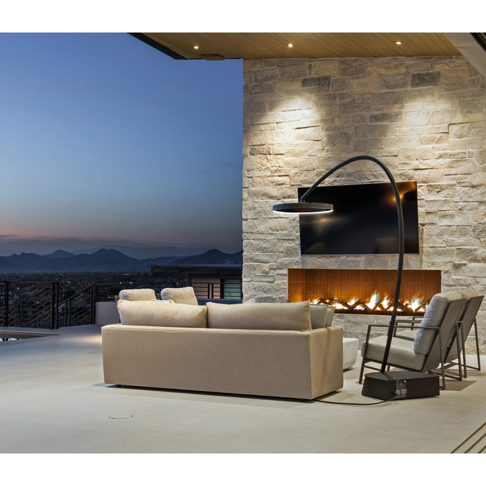 Modern outdoor living space with a fireplace, Bromic Eclipse Portable and scenic view