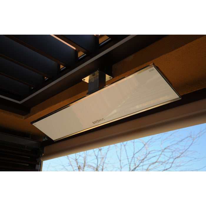 White Bromic electric heater mounted on a wooden pergola with a clear sky background