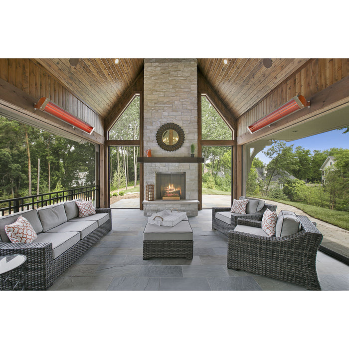 Outdoor patio with wicker furniture, fire pit, and heaters in a modern home setting.