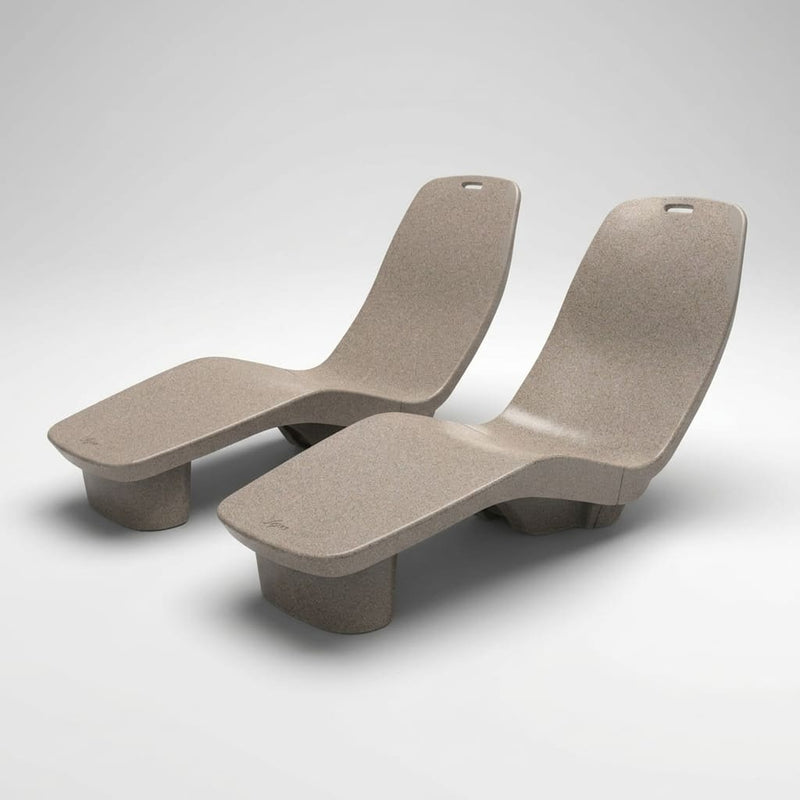 Two beige lounge chairs by TenJam on a white background
