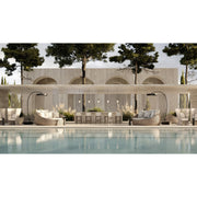 Outdoor setting with a pool, seating area, Bromic Eclipse Portable heaters and building in the background.