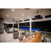 Bromic Eclipse Heaters in Modern indoor-outdoor living space with a pool, dining table, and chairs.