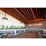Eclipse Heaters by Bromic used in Modern interior design with wooden ceiling, plants, and a motivational quote on the wall.