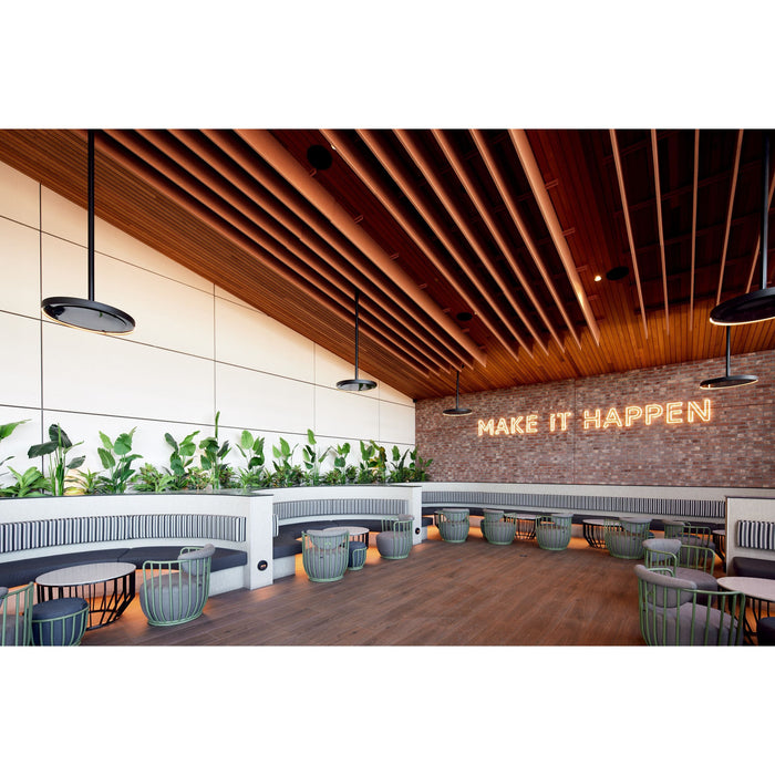 Eclipse Heaters by Bromic used in Modern interior design with wooden ceiling, plants, and a motivational quote on the wall.