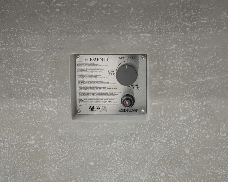 Control panel with 'Elementi' branding on a textured gray wall