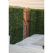 Artificial Boxwood Mat with Faux Flowers Installed Outdoors onto a Fence