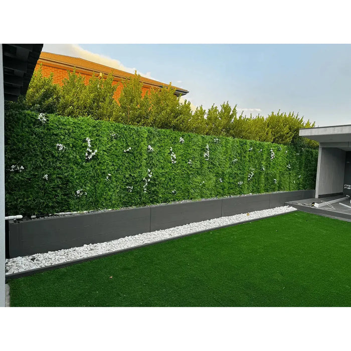 Artificial green plant wall in a modern outdoor garden area