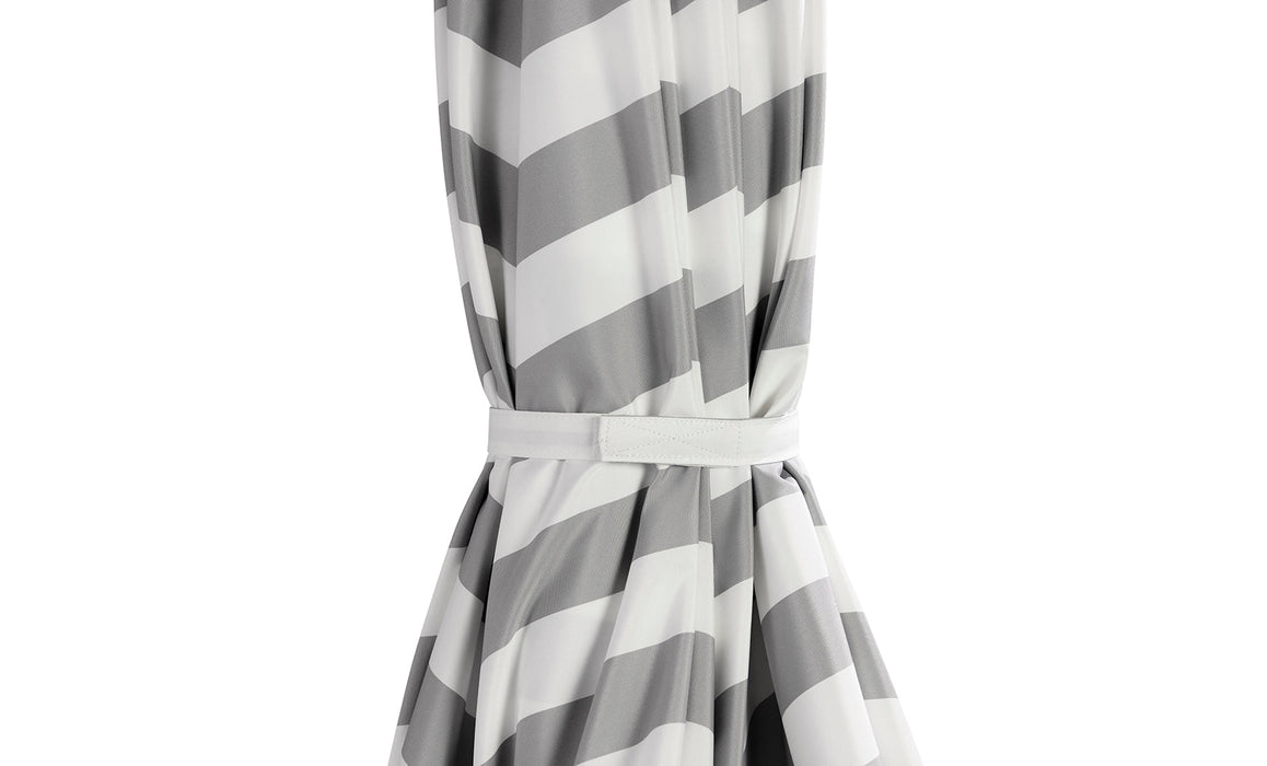 Close up of Ledge Lounger Signature umbrella gray and white canopy color in its closed position