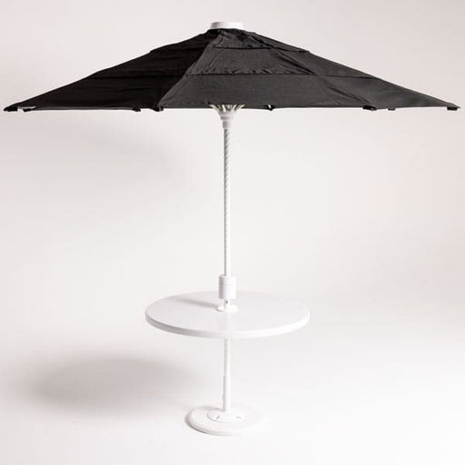 Black patio umbrella on a white stand against a white background