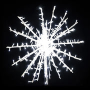 Decorative snowflake light fixture on a black background