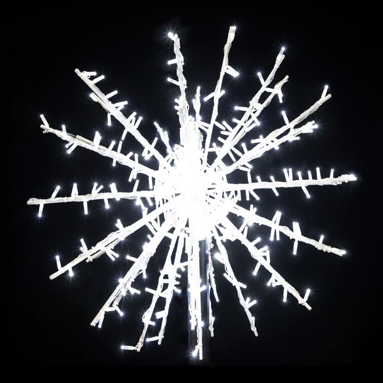 Decorative snowflake light fixture on a black background