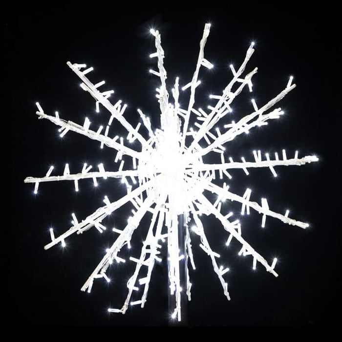 Decorative snowflake light fixture on a black background