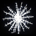 Decorative snowflake light fixture on a black background