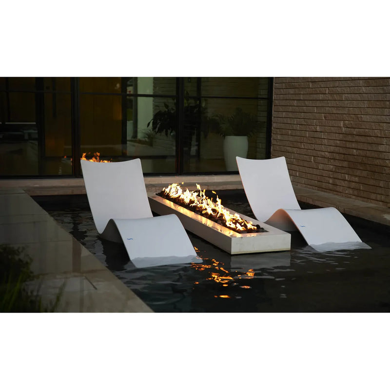 Modern outdoor fire pit between two white Autograph sunloungers in a pool tanning ledge