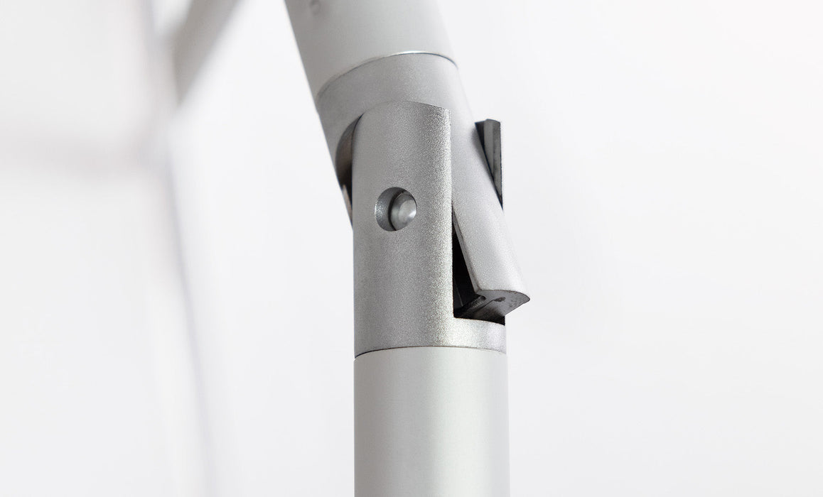 Close up of the tilt system feature of a Ledge Lounger Signature umbrella on a white background