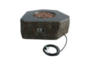 Hexagonal Columbia fire pit by Elementi with rocks and power cord on a white background