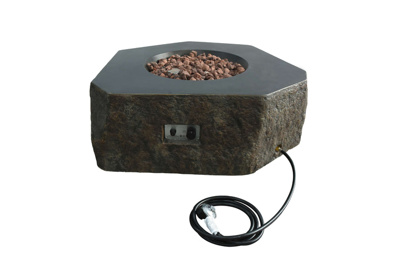Hexagonal Columbia fire pit by Elementi with rocks and power cord on a white background