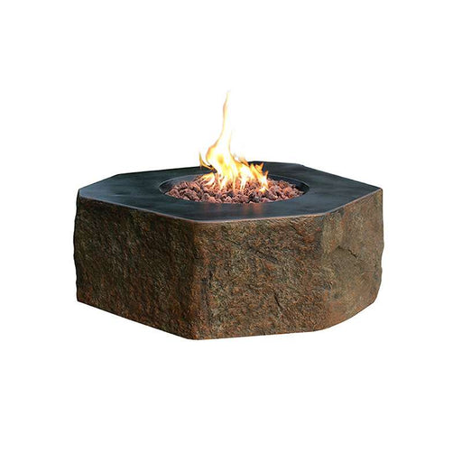 Hexagonal Columbia stone fire pit by Elementi with flames on a white background