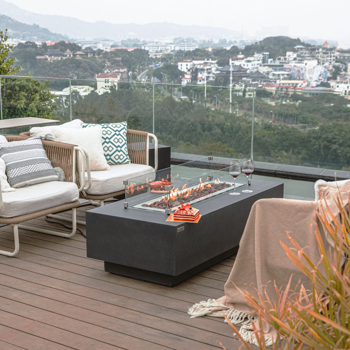 Granville Fire Table by Elementi in Dark Gray on a patio deck with glass wind guards