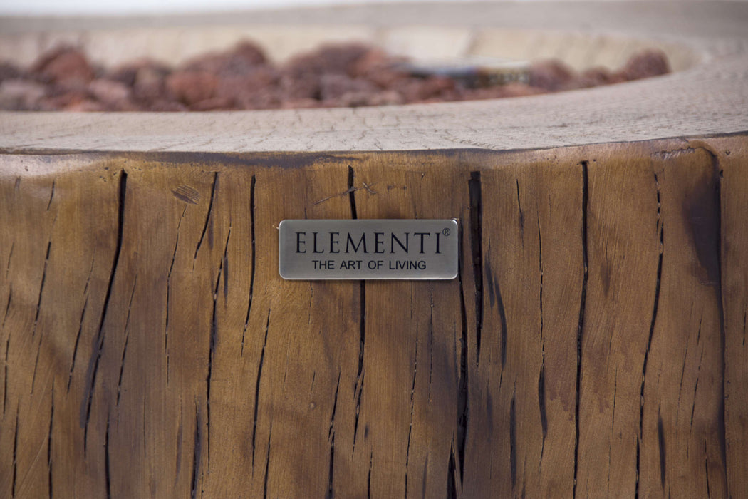 Elementi Manchester Wooden fire pit with 'Elementi' brand logo on a blurred natural background
