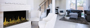 Modern living room with a fireplace, white sofa, and gray armchair.