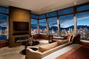 Luxury living room with cityscape view from large windows