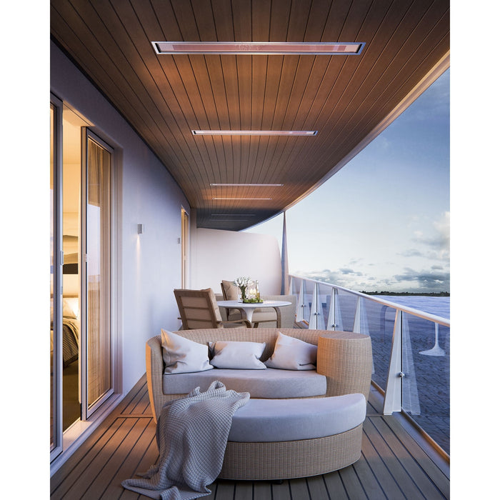 Modern cruise ship balcony with outdoor furniture and ocean view. Bromic Marine Heaters pictured flush mounted into the ceiling above