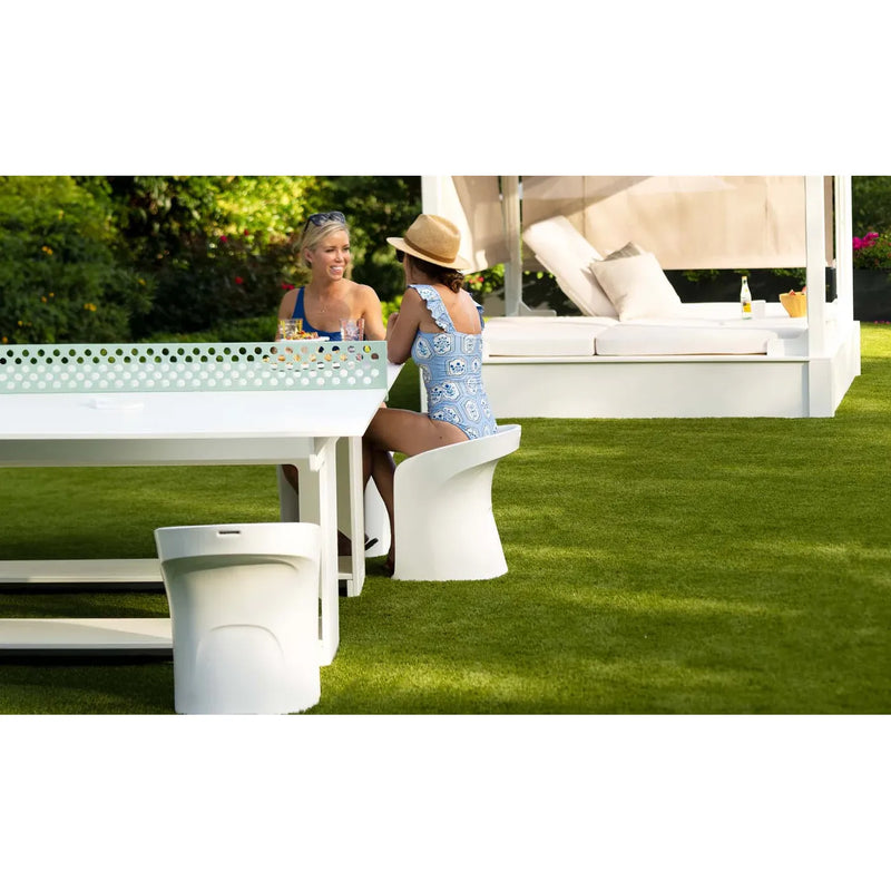 Ladies sitting on bar stools poolside