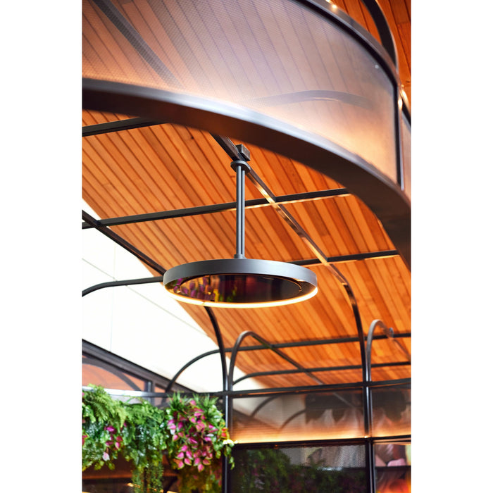 Bromic Eclipse twin pole fixture in a modern indoor setting with wooden ceiling