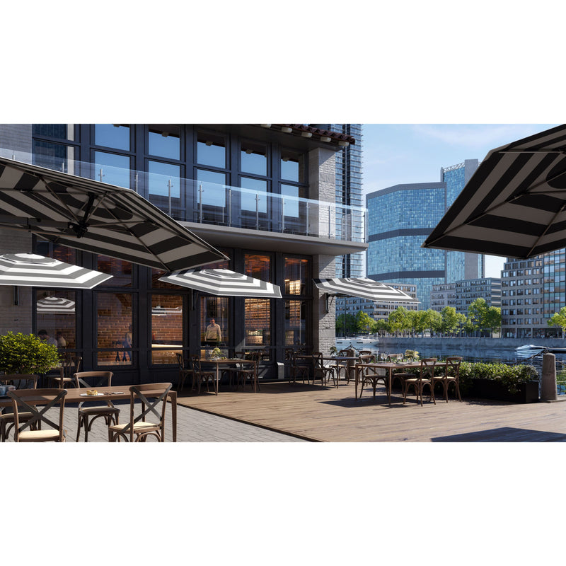 Shadowspec Retreat umbrellas with striped canopies being used in a commercial patio space providing shade for eating and drinking