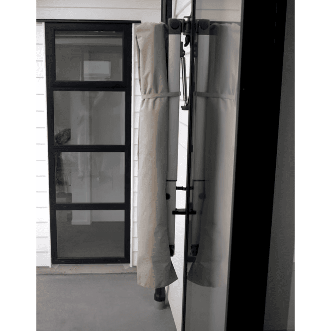 Shadowspec Retreat Wall Mounted Umbrella closed and wrapped in protective cover. 