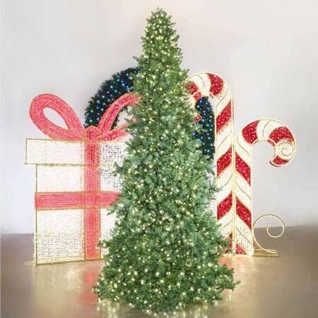 Decorative Christmas scene with a tree, presents, and candy canes on a light background