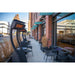 Outdoor seating area with chairs and tables in front of a Starbucks Reserve  with 3 Tungsten Portable Heaters lined up