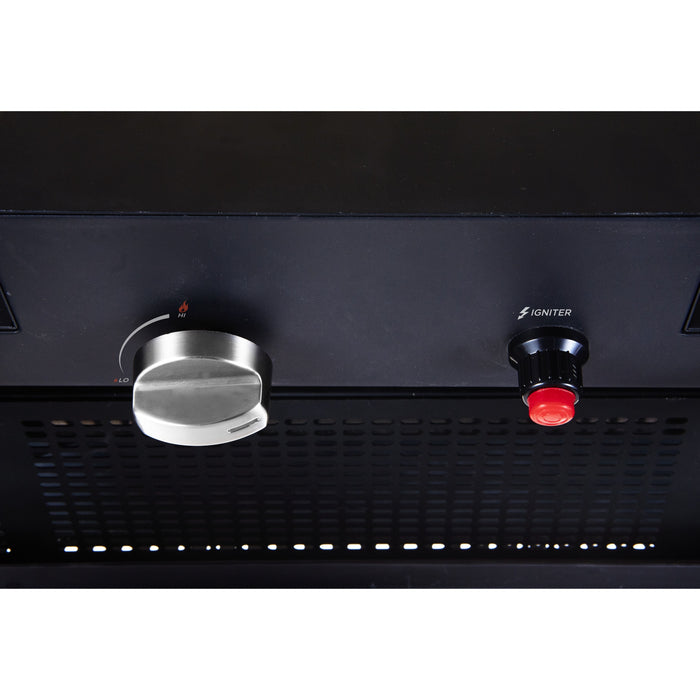 Control panel with a knob and igniter button on a black surface of a Bromic heater